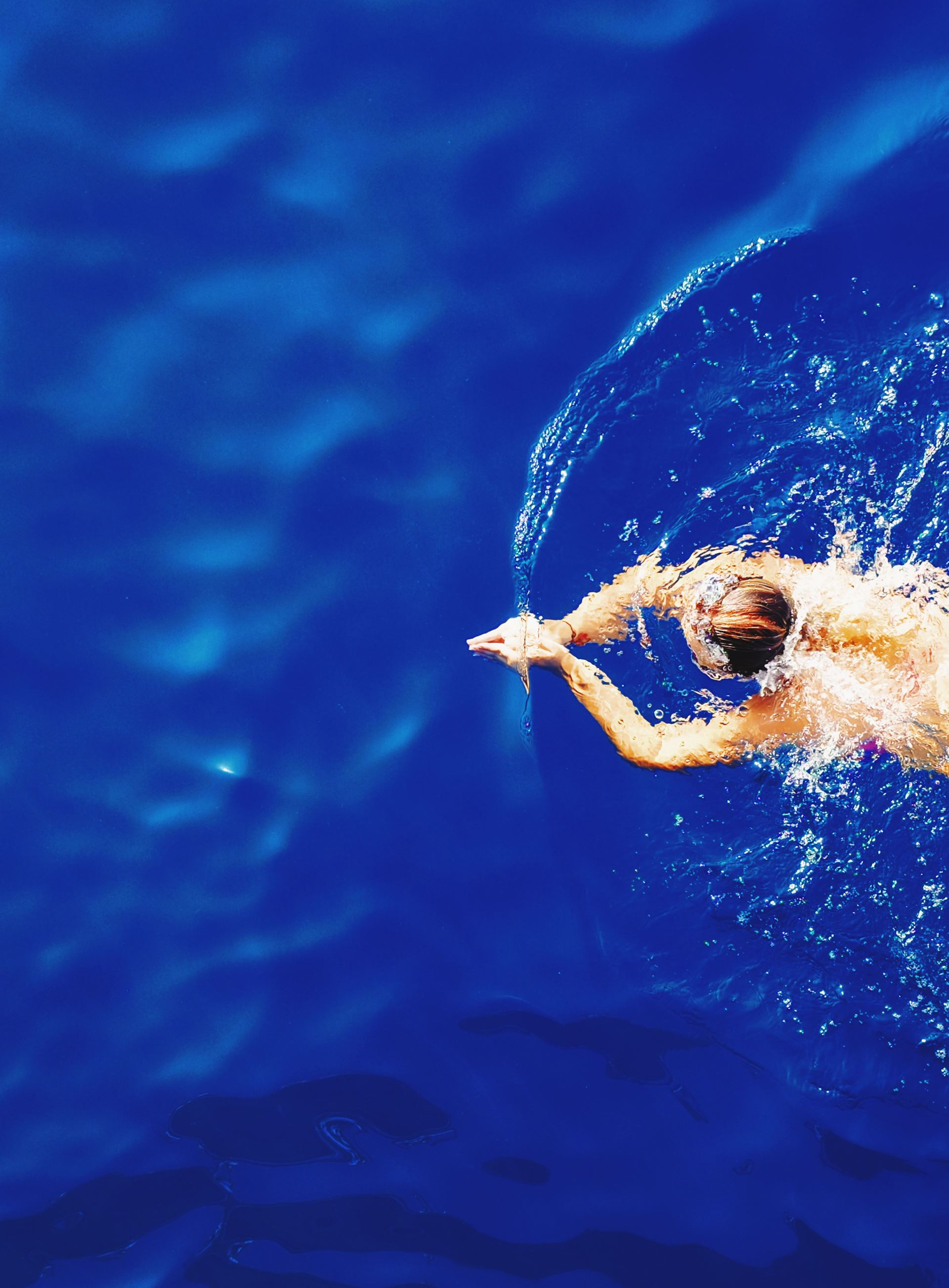 a person swimming in the water