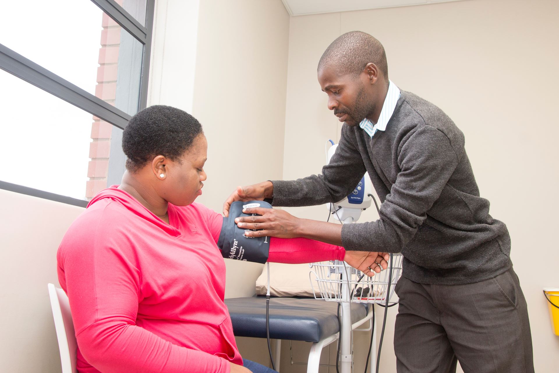 patient having blood pressure taken