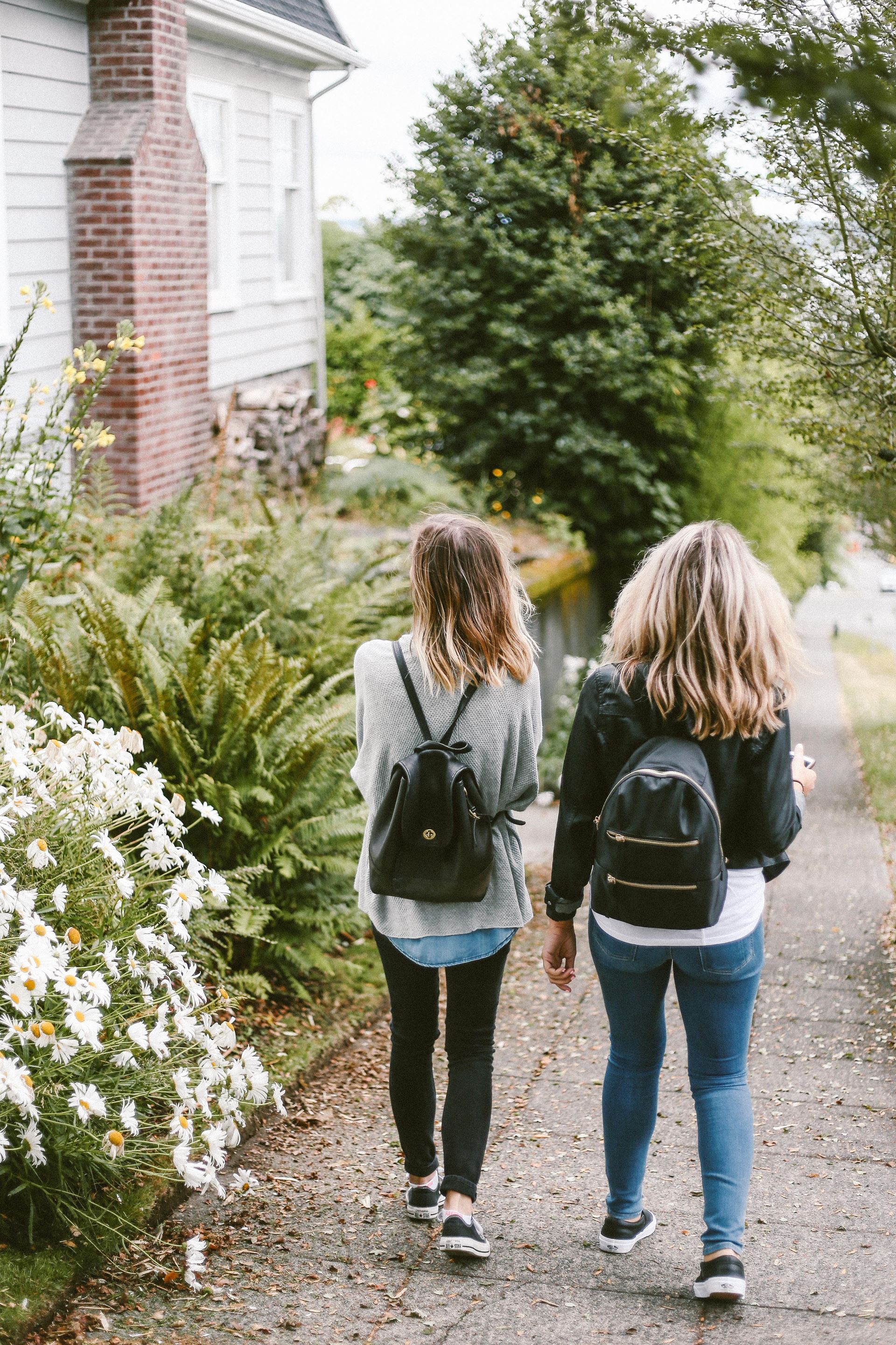 two girls walking away